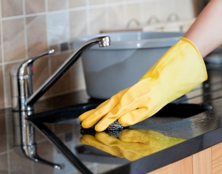Carpet cleaning technician using safe equipment in a Ruislip property