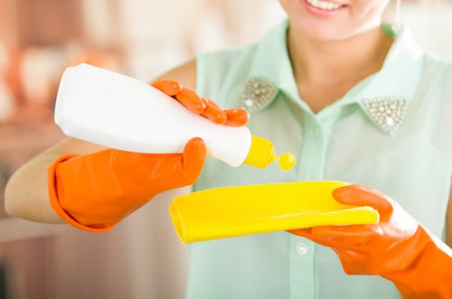 Technician wearing PPE while cleaning a carpet