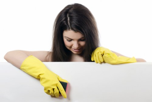 Local cleaner performing detailed housekeeping work in Ruislip