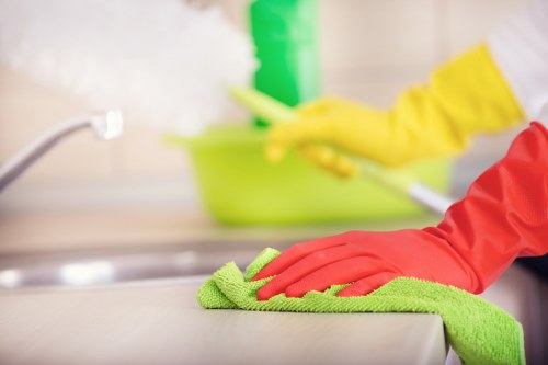Office cleaners sanitising desks and shared surfaces in Ruislip